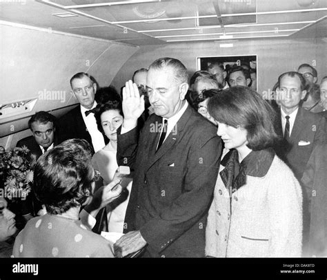 LYNDON B. JOHNSON is sworn in as President aboard Air Force One 22 ...