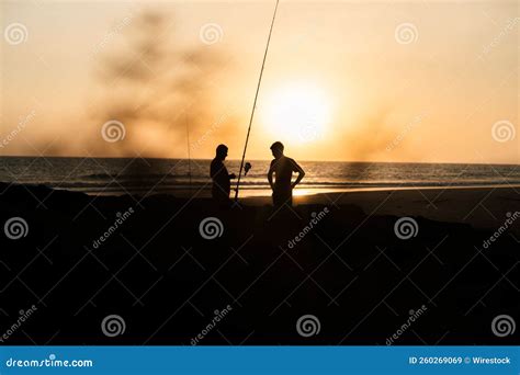 Silhouette of Fishermen on a Sandy Beach during the Sunset Stock Image - Image of landscape ...