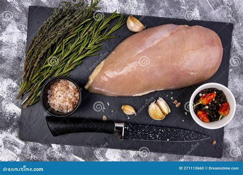 Seasoned Chicken Breast on Cutting Stone Board with Spices, Top View ...