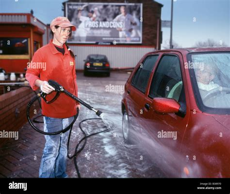 Woman working in carwash Stock Photo - Alamy
