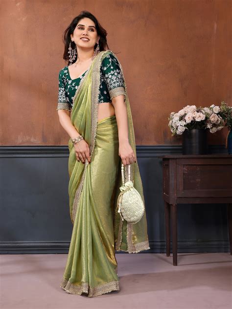 Solid saree with heavy embellished border & contrast floral embroidere ...