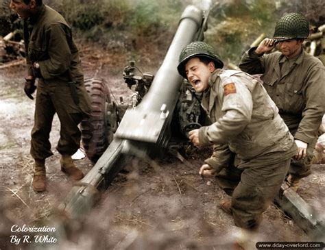 American artillery crew firing rounds from a M3 105mm Howitzer at ...