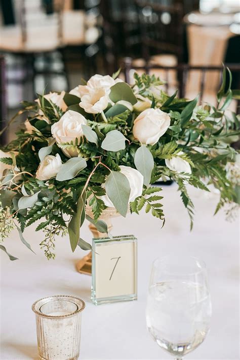 greenery & white flower centerpiece in gold vase | White flower ...