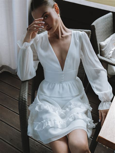 V-neck mini dress with decorative buttons :: LICHI - Online fashion store