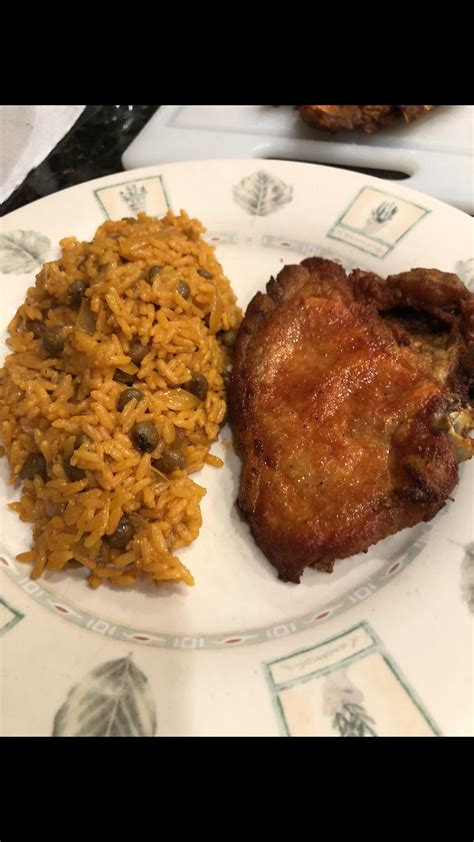 A Puerto Rican classic: homemade Spanish rice and fried pork chops ...