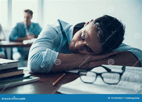 Sleeping In Class College Male College Student Sleeping Through A