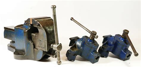 A Record table top vice, No 23, stamped Made In England, together with ...