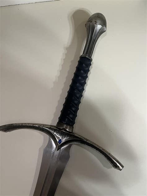 My mom found an old Gandalf sword replica in our garage, and it’s ...