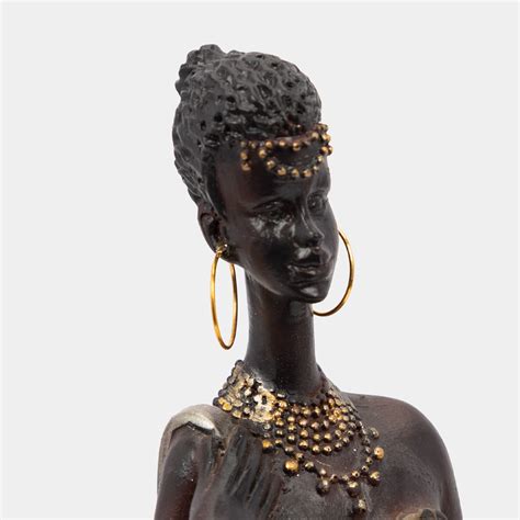 Figura de mujer con bolso poliresina 37.2 x 9.3 x 7.1 cm