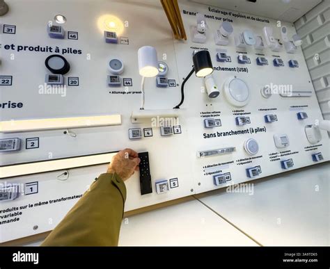 Paris, France - Mar 27, 2025: A wall-mounted lighting demo panel in a ...