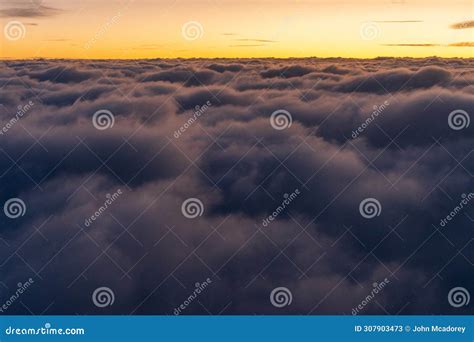 Sunrise Above the Clouds on a Flight from Washington DC To Austin Texas ...