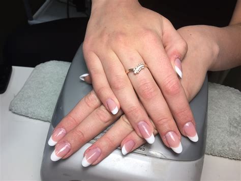 Sculpted acrylic nail extensions with french tips. Oval shape. # ...