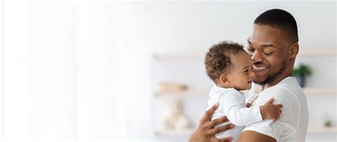 Child care portrait of happy african american father with infant baby ...