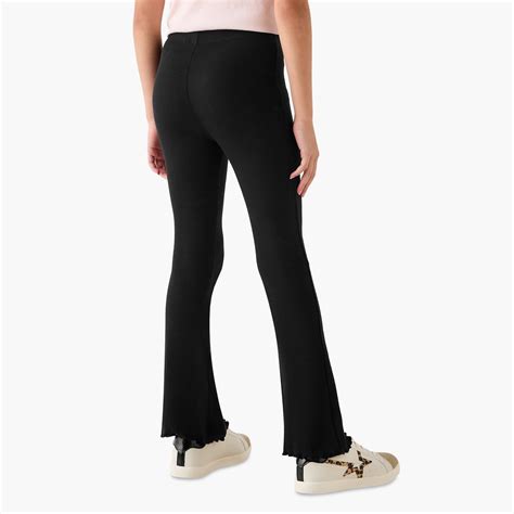 Buy Juniors Ribbed Flared Leggings with Lettuce Hem from Juniors at ...