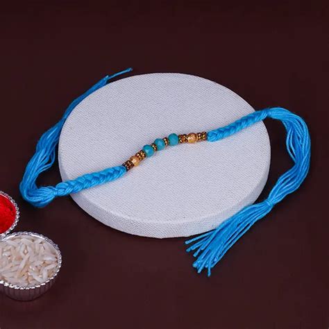 Send Royal Blue and Golden Designer Rakhi Online | Rakhibazaar.com