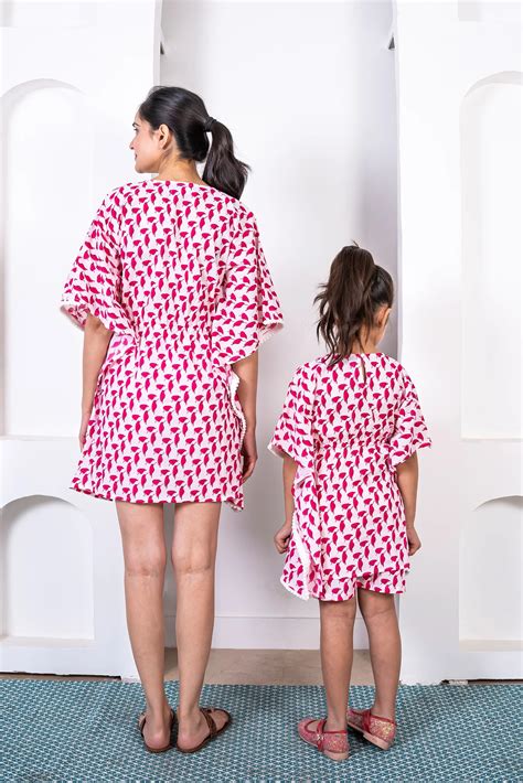 Stylish Holiday Wear: Matching Outfits for Mom and Daughter - White an