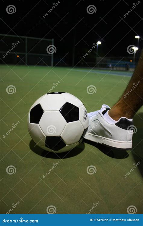 Kicking Soccer Ball stock photo. Image of boots, action - 5742622
