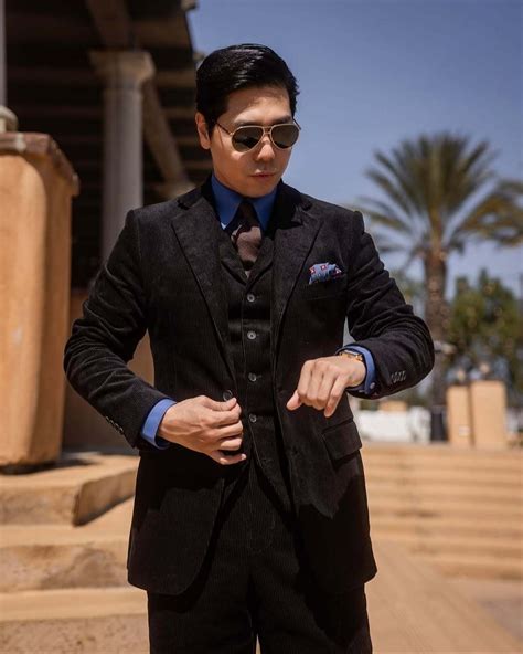 Brown Corduroy Safari Jacket with Black Suit and Blue Shirt | Hockerty