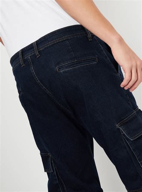 Buy Men Carrot Fit Washed Cargo Jeans Online at just Rs. 1499.0 ...