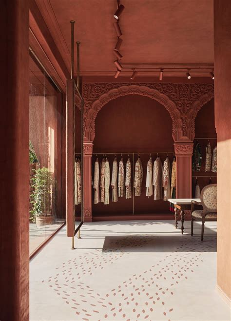 A sandstone envelope and subtle arches define this menswear store in ...