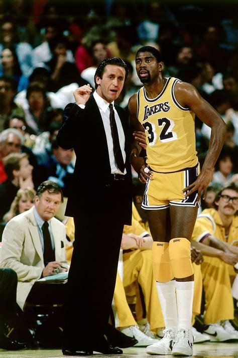 Pat Riley and Magic Johnson- 1984 Haha. Those knee pads! Oh come on ...