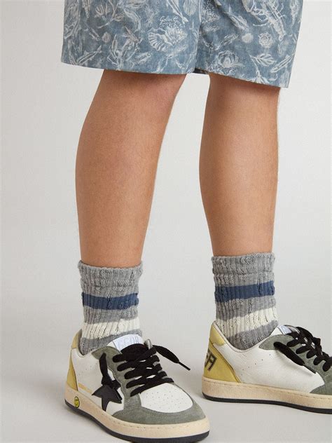 Kids’ gray socks with distressed details and worn-white and blue stripes