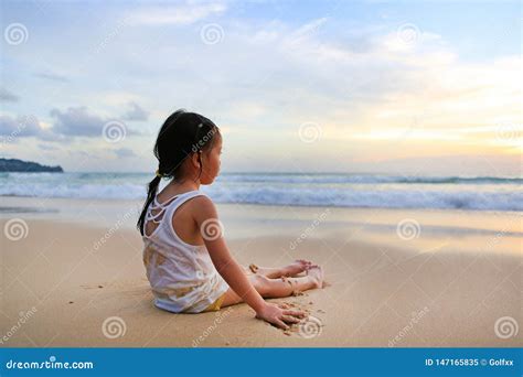 Asian Girl Sitting on the Beach Alone at the Sunset Stock Image - Image ...