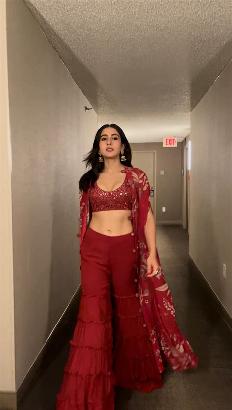 Sara Ali Khan raises the hotness quotient this festive season in red gharara with bling bralette ...