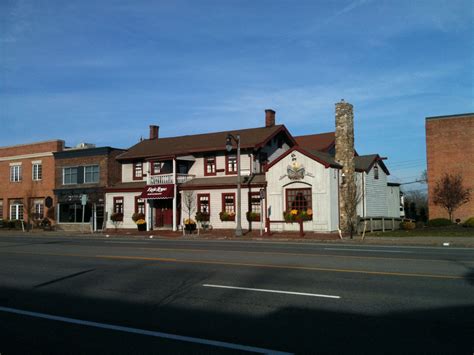 Eagle House Restaurant | White and Brown Building with Red Trim