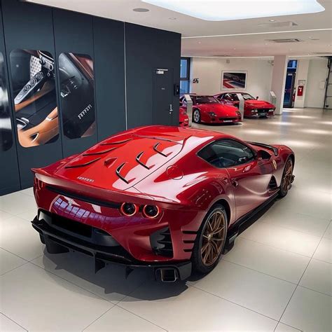 Ferrari 812 competizione in the shade of ROSSO BERLINETTA with golden ...