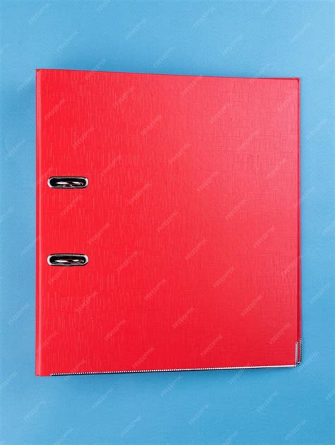 Red office folder on blue background office folder template | Premium Photo