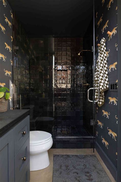 Small Black Bathrooms A Small Bathroom With Black And White Tiles On