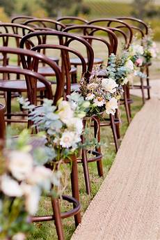 Outdoor Wedding Ceremony Without Chairs by Like These Wooden Chairs With A Clump Of Flowers Outdoor Wedding Ceremony Without Chairs