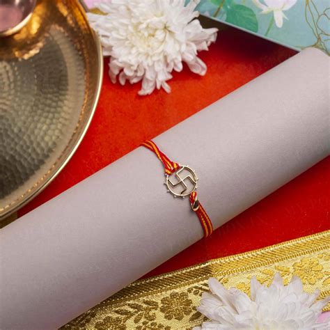 Buy Gold Swastik Rakhi Online in India - Mypoojabox.in