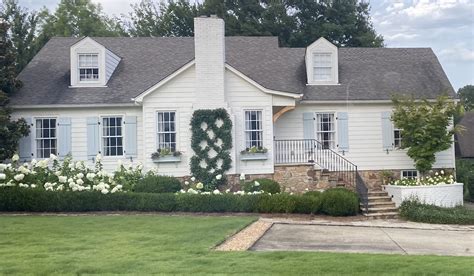 Charming White House with Blue Shutters