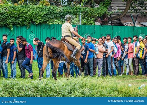 Mounted Police in Action, Controlling a Crowd at the Entrance of a ...
