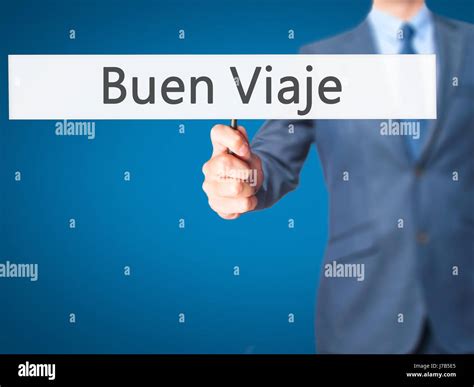 Buen Viaje (Good Trip in Spanish) - Businessman hand holding sign ...