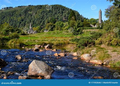 Landscape with River and Celtic Round Tower Glendalough Stock Photo ...