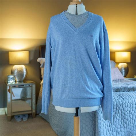 Lacoste Mens jumper. Light blue in colour with... - Depop