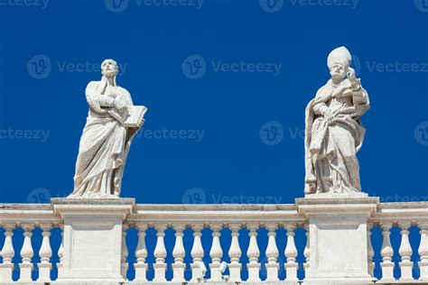 Detail of the statues of saints that crown the colonnades of St. Peter Square built on 1667 on ...