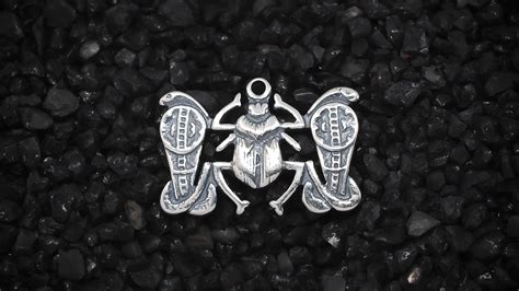 The Egyptian Scarab Beetle Charm: Symbolism and Significance