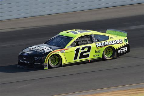 Download Ryan Blaney Yellow Race Car Wallpaper | Wallpapers.com