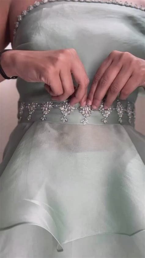 handcrafted embellished peplum top and pants.