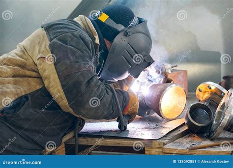 Manual Electric Arc Welding of the Junction Du 100 and Flange Stock ...