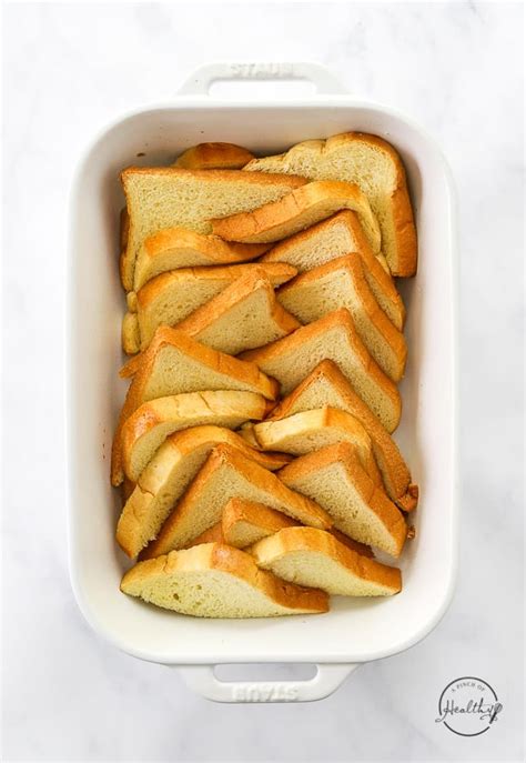 https://www.apinchofhealthy.com/wp-content/uploads/2022/12/Sliced-bread-layered-in-pan-2.jpg