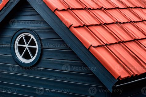 Red roof tiles covering modern wooden house with round window 61900341 ...