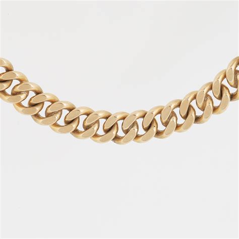 An 18K gold charm bracelet. - Bukowskis