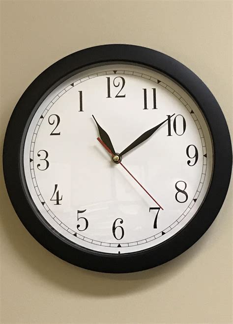 This clock in a co-workers office. All the hands rotate counter ...