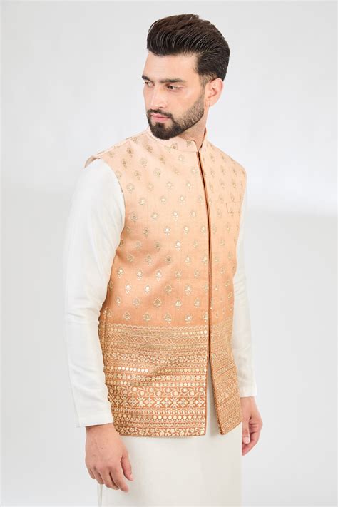 Ombre shaded coral peach nehru jacket with zari embroidery.