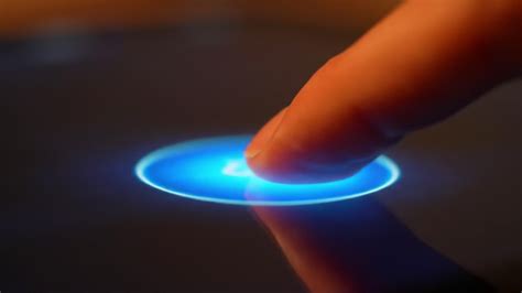 An Engaging Interaction: A Finger Touches a Glowing Circular Interface ...